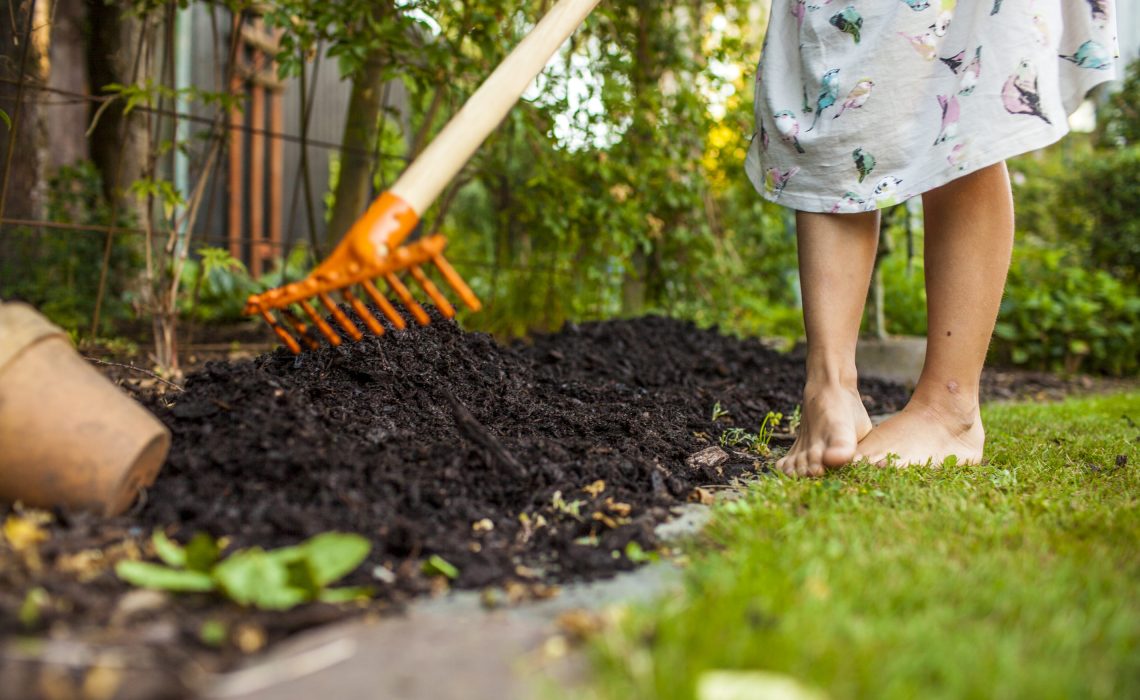 girl-spreading-fertilizer