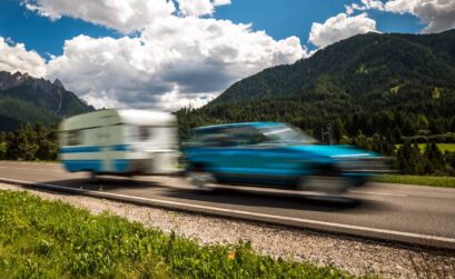 Family vacation travel, holiday trip in motorhome RV, Caravan car Vacation. Beautiful Nature Italy natural landscape Alps. Warning - authentic shooting there is a motion blur.